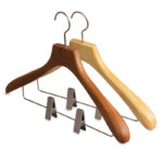 Sturdy wooden coat hanger with movable clips